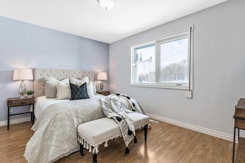 180 16Th Avenue Sw, Diamond Valley, AB - Indoor Photo Showing Bedroom