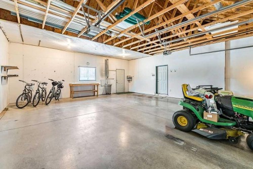 180 16Th Avenue Sw, Diamond Valley, AB - Indoor Photo Showing Garage