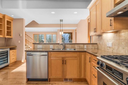 4-124 Silvertip Ridge, Canmore, AB - Indoor Photo Showing Kitchen With Double Sink
