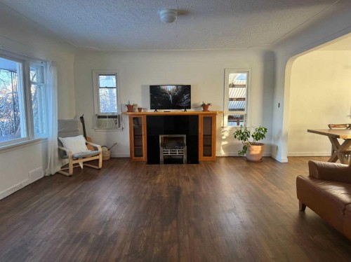2912 21 Avenue Sw, Calgary, AB - Indoor Photo Showing Living Room With Fireplace