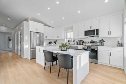 117 Rocky Ridge Landing Nw, Calgary, AB - Indoor Photo Showing Kitchen With Stainless Steel Kitchen With Upgraded Kitchen