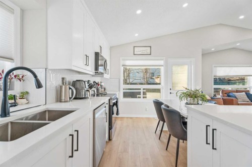 117 Rocky Ridge Landing Nw, Calgary, AB - Indoor Photo Showing Kitchen With Double Sink With Upgraded Kitchen