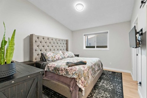 117 Rocky Ridge Landing Nw, Calgary, AB - Indoor Photo Showing Bedroom