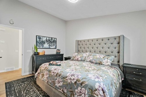 117 Rocky Ridge Landing Nw, Calgary, AB - Indoor Photo Showing Bedroom