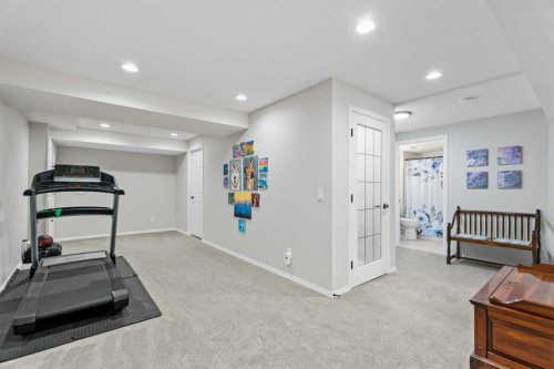 117 Rocky Ridge Landing Nw, Calgary, AB - Indoor Photo Showing Gym Room
