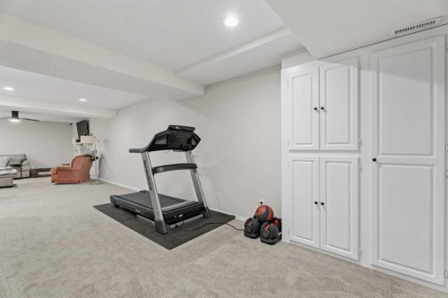 117 Rocky Ridge Landing Nw, Calgary, AB - Indoor Photo Showing Gym Room