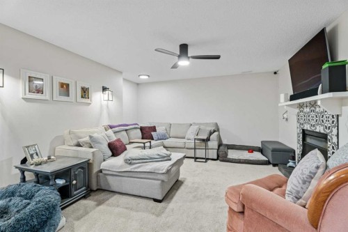 117 Rocky Ridge Landing Nw, Calgary, AB - Indoor Photo Showing Living Room