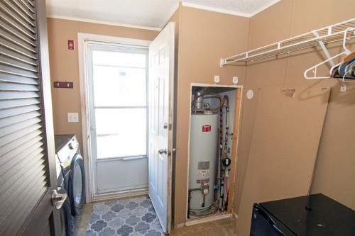 10 Westmount Drive, Cayley, AB - Indoor Photo Showing Laundry Room