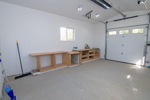 10 Westmount Drive, Cayley, AB - Indoor Photo Showing Garage