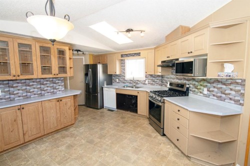 10 Westmount Drive, Cayley, AB - Indoor Photo Showing Kitchen With Double Sink