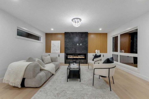 9419 Academy Drive Se, Calgary, AB - Indoor Photo Showing Living Room With Fireplace