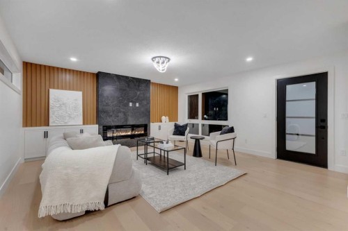 9419 Academy Drive Se, Calgary, AB - Indoor Photo Showing Other Room With Fireplace