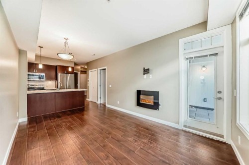 108-28 Auburn Bay Link Se, Calgary, AB - Indoor With Fireplace