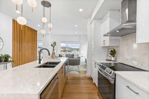401-200 Belvedere Boulevard Se, Calgary, AB - Indoor Photo Showing Kitchen With Double Sink With Upgraded Kitchen