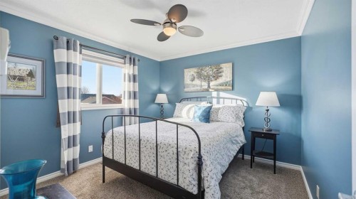 1-2 Hinshaw Drive, Sylvan Lake, AB - Indoor Photo Showing Bedroom