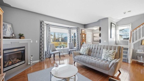 1-2 Hinshaw Drive, Sylvan Lake, AB - Indoor Photo Showing Living Room With Fireplace