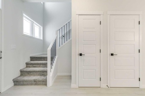 186 Creekside Manor Sw, Calgary, AB - Indoor Photo Showing Other Room