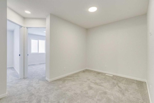 186 Creekside Manor Sw, Calgary, AB - Indoor Photo Showing Other Room