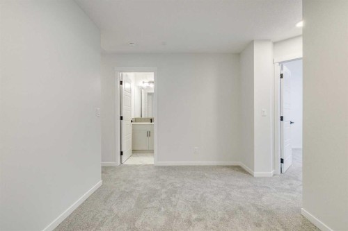 186 Creekside Manor Sw, Calgary, AB - Indoor Photo Showing Other Room