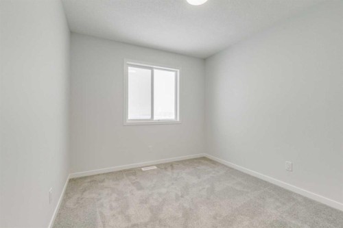 186 Creekside Manor Sw, Calgary, AB - Indoor Photo Showing Other Room