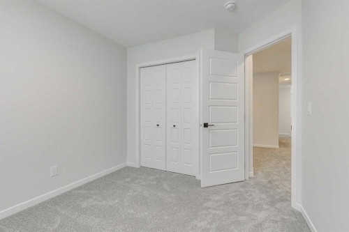 186 Creekside Manor Sw, Calgary, AB - Indoor Photo Showing Other Room
