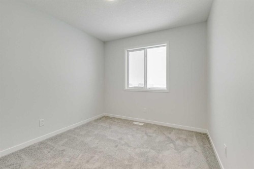 186 Creekside Manor Sw, Calgary, AB - Indoor Photo Showing Other Room