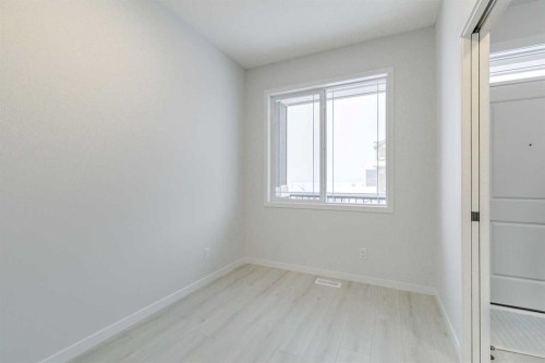 186 Creekside Manor Sw, Calgary, AB - Indoor Photo Showing Other Room