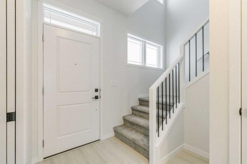 186 Creekside Manor Sw, Calgary, AB - Indoor Photo Showing Other Room