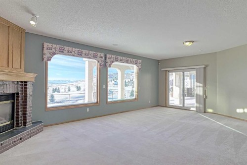 54 Eagleview Way, Cochrane, AB - Indoor With Fireplace