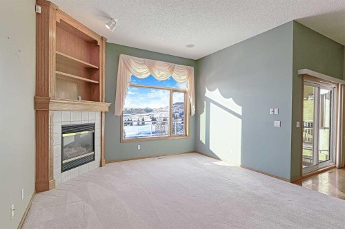 54 Eagleview Way, Cochrane, AB - Indoor With Fireplace