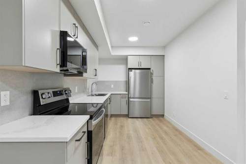 148 Marina Grove, Calgary, AB - Indoor Photo Showing Kitchen With Double Sink
