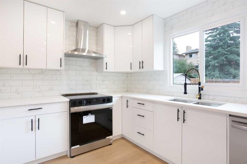24 Hawkwood Crescent Nw, Calgary, AB - Indoor Photo Showing Kitchen With Double Sink With Upgraded Kitchen