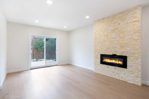 24 Hawkwood Crescent Nw, Calgary, AB - Indoor Photo Showing Living Room With Fireplace