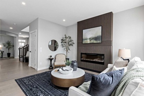36 Creekstone Grove Sw, Calgary, AB - Indoor Photo Showing Living Room With Fireplace