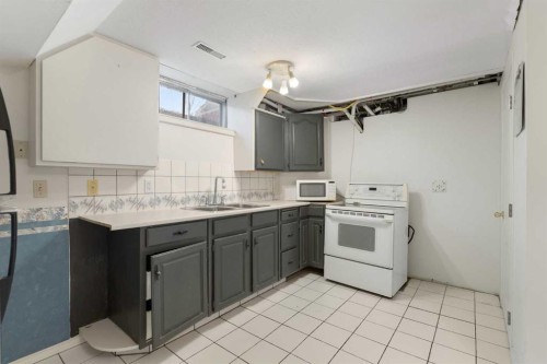 159 Brookgreen Drive Sw, Calgary, AB - Indoor Photo Showing Kitchen With Double Sink