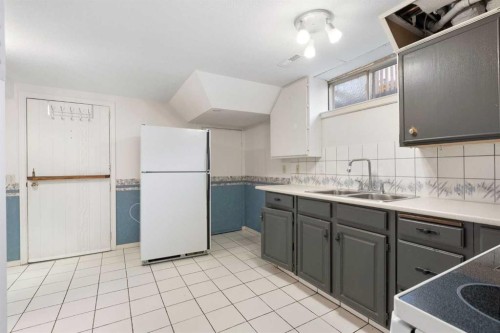 159 Brookgreen Drive Sw, Calgary, AB - Indoor Photo Showing Kitchen With Double Sink