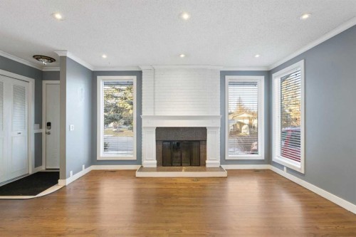 159 Brookgreen Drive Sw, Calgary, AB - Indoor Photo Showing Living Room With Fireplace