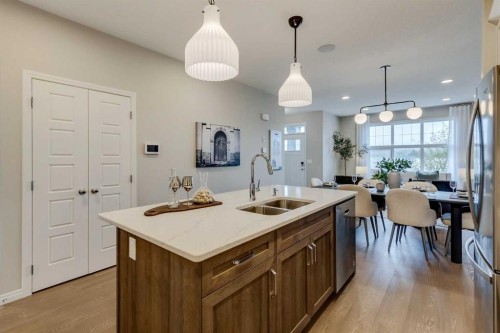 92 Creekside Street Sw, Calgary, AB - Indoor Photo Showing Kitchen With Double Sink