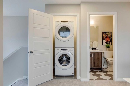 92 Creekside Street Sw, Calgary, AB - Indoor Photo Showing Laundry Room