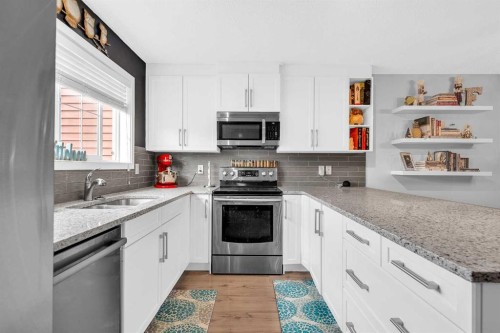 381 Legacy Boulevard Se, Calgary, AB - Indoor Photo Showing Kitchen With Stainless Steel Kitchen With Double Sink