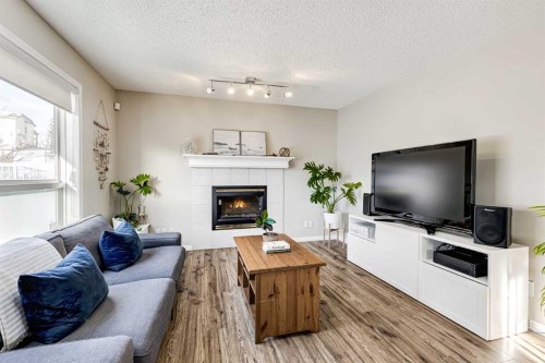157 Arbour Crest Road Nw, Calgary, AB - Indoor Photo Showing Living Room With Fireplace