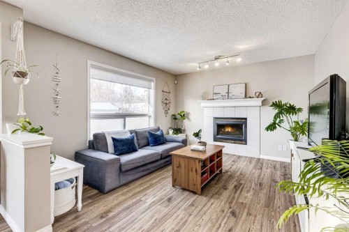 157 Arbour Crest Road Nw, Calgary, AB - Indoor Photo Showing Living Room With Fireplace