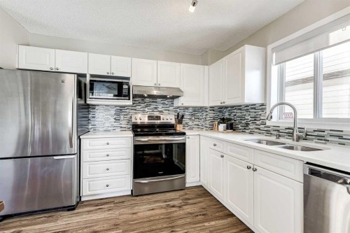 157 Arbour Crest Road Nw, Calgary, AB - Indoor Photo Showing Kitchen With Double Sink With Upgraded Kitchen