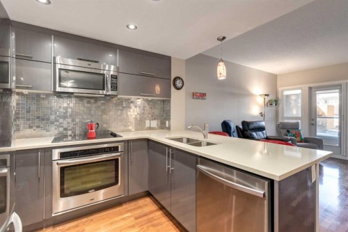 219-1110 3 Avenue, Calgary, AB - Indoor Photo Showing Kitchen With Stainless Steel Kitchen With Double Sink With Upgraded Kitchen