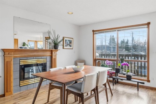 4507 37 Avenue Sw, Calgary, AB - Indoor Photo Showing Dining Room With Fireplace