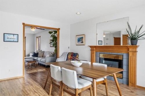 4507 37 Avenue Sw, Calgary, AB - Indoor Photo Showing Dining Room With Fireplace