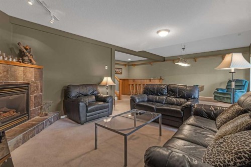 28 Prominence View Sw, Calgary, AB - Indoor Photo Showing Living Room With Fireplace