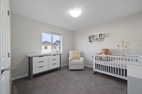 418 Windrow Common Sw, Airdrie, AB - Indoor Photo Showing Bedroom