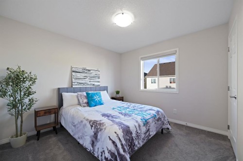418 Windrow Common Sw, Airdrie, AB - Indoor Photo Showing Bedroom