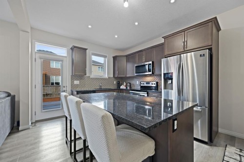 418 Windrow Common Sw, Airdrie, AB - Indoor Photo Showing Kitchen With Stainless Steel Kitchen With Upgraded Kitchen